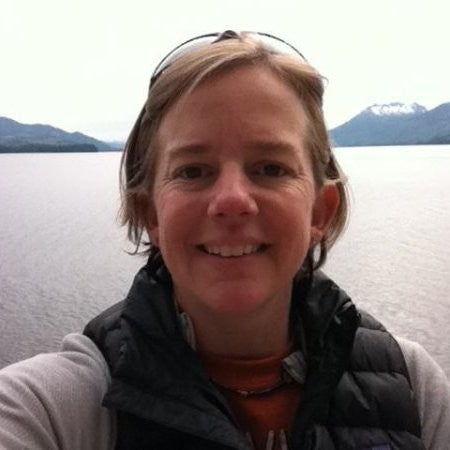 Close up of woman with mountains and water